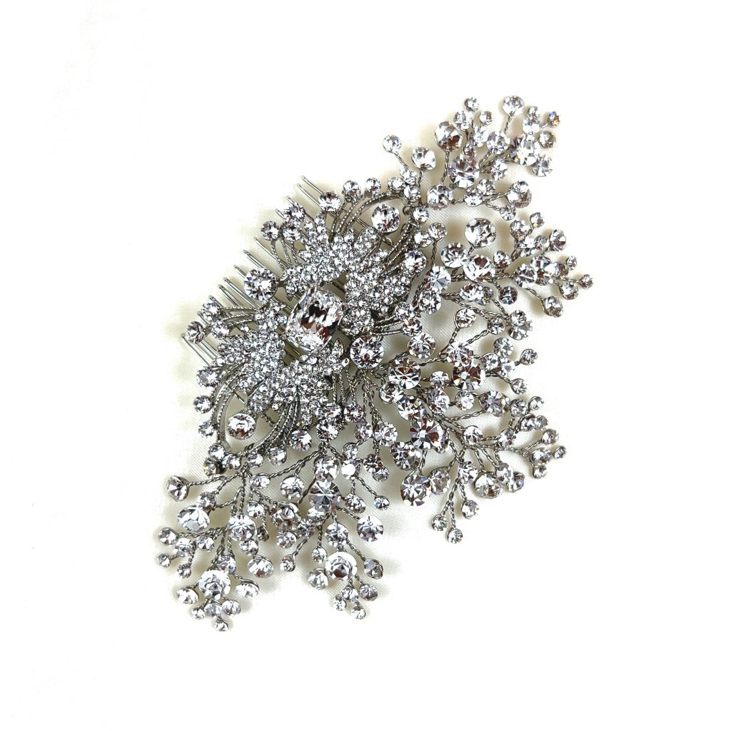 silver bridal hair comb with single crystal center, clusters and sprigs of round crystals