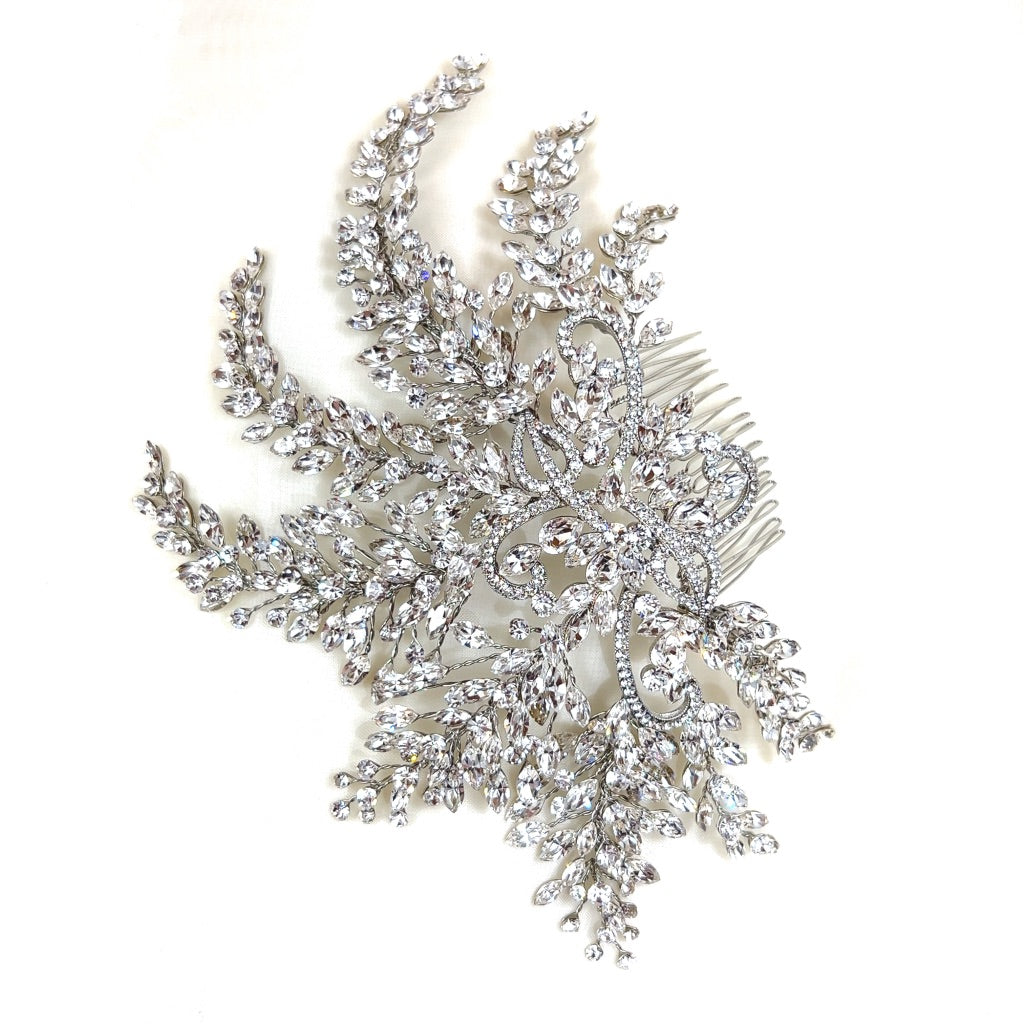 bridal comb with swirling silver details and various sweeping crystal sprays