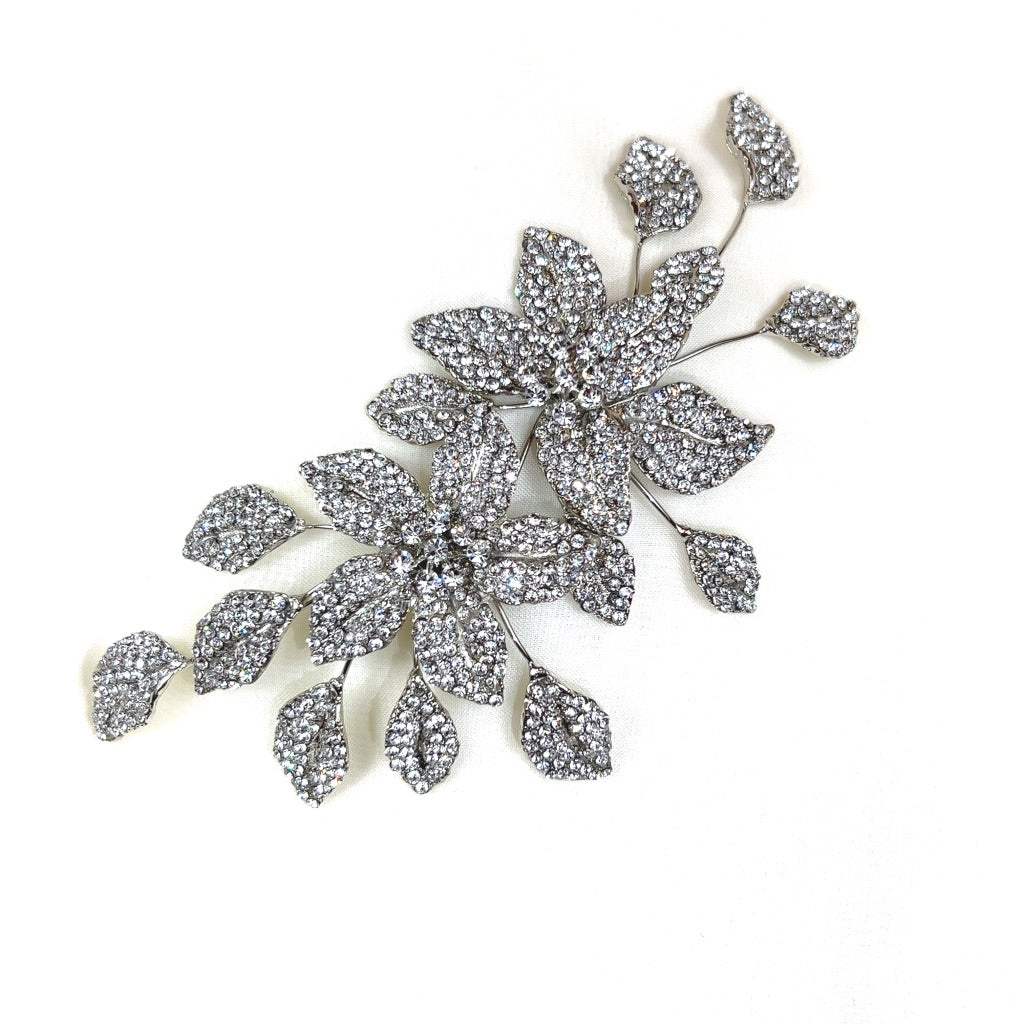 The Swarovski Crystal Double Flower Comb (style no. 80091) is a sparkling bridal hair accessory with floral and leaf designs. It is beautifully set on a plain white background.