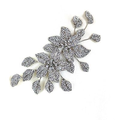 silver bridal hair comb with crystalized flowers and sprigs of leaves