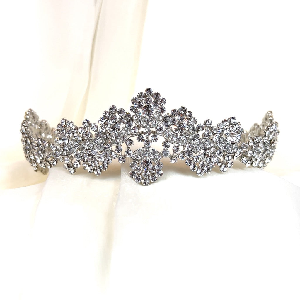 bridal tiara with swirling silver shape and round crystal clusters