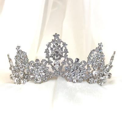 silver bridal crown with various round crystal peaks and floral cluster details