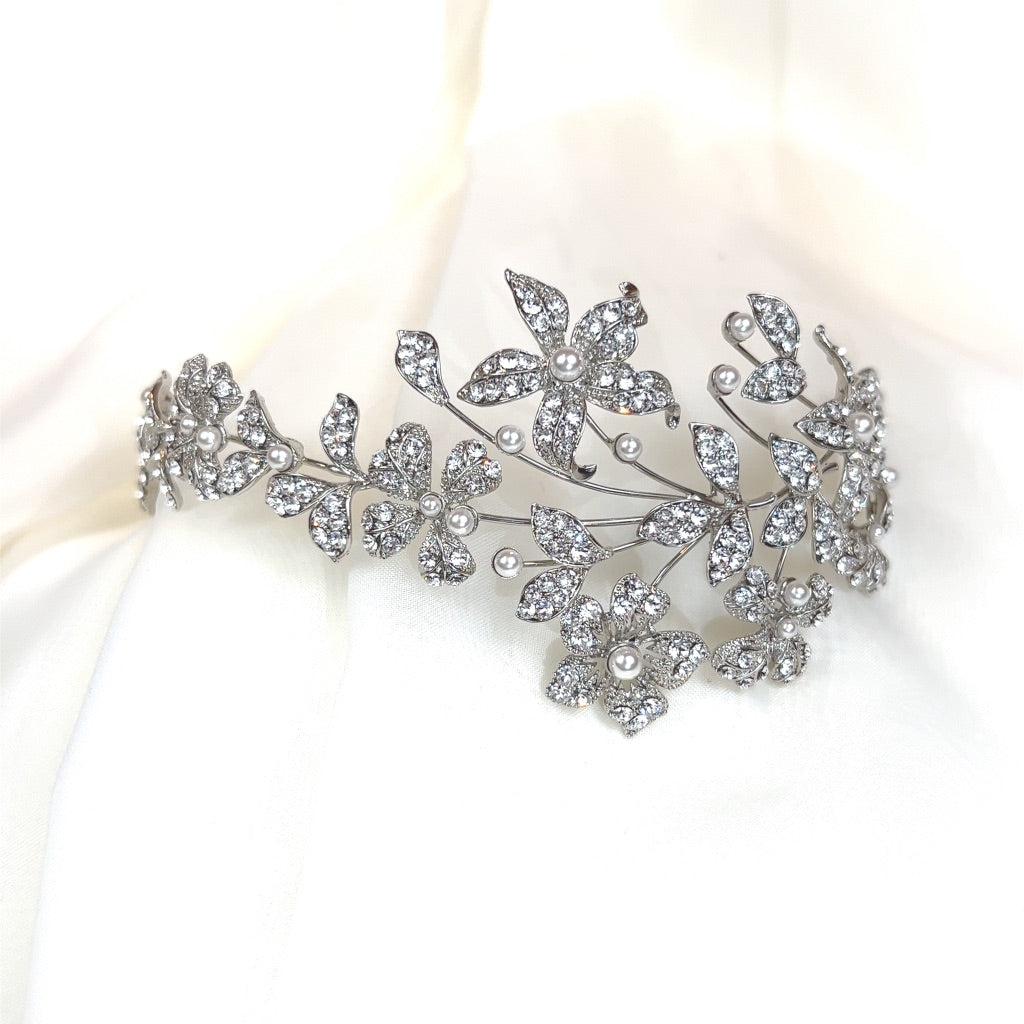 asymmetrical silver bridal headband with crystalized floral details and pearls