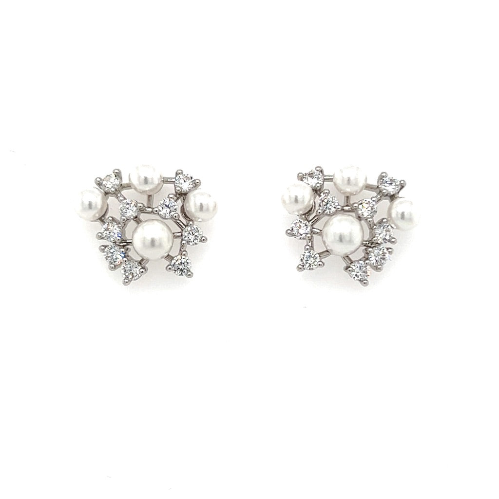 The Cluster Stud CZ Bridal Earrings (style no. E194), with their floral design featuring clusters of pearls and sparkling stones, exude an enchanting bridal allure.