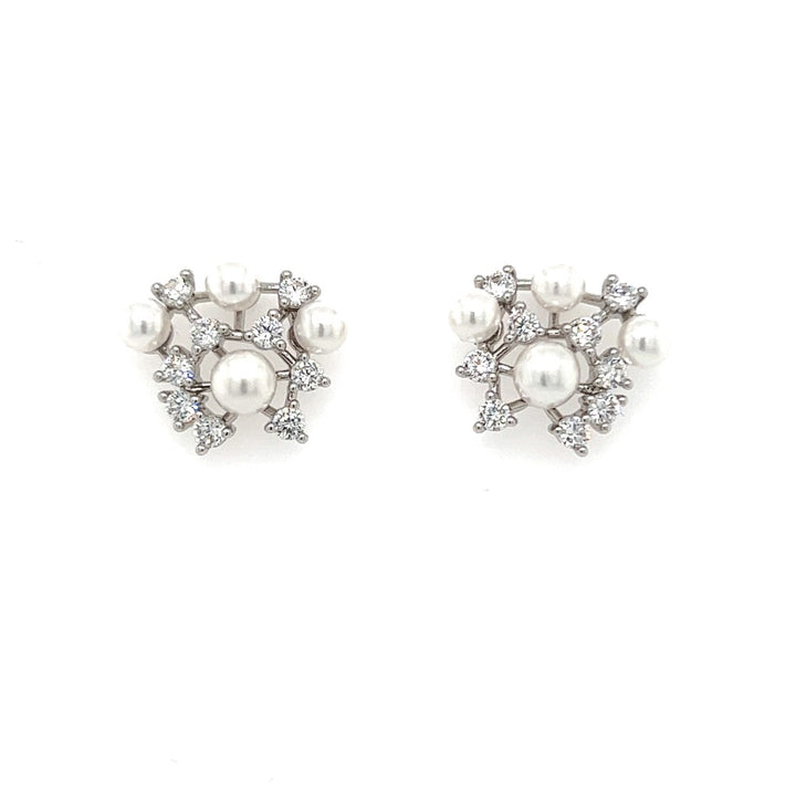 The Cluster Stud CZ Bridal Earrings (style no. E194), with their floral design featuring clusters of pearls and sparkling stones, exude an enchanting bridal allure.