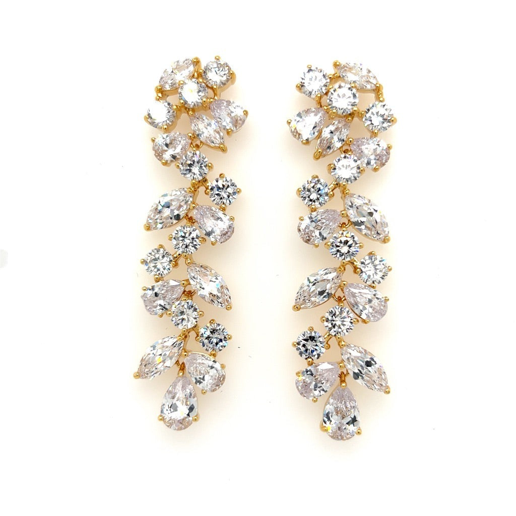 The Sophisticated Long Dangle Bridal Earrings (style no. E140) feature sparkling clear cubic zirconia teardrop and round gems in a cascading leafy design—an elegant choice for weddings.