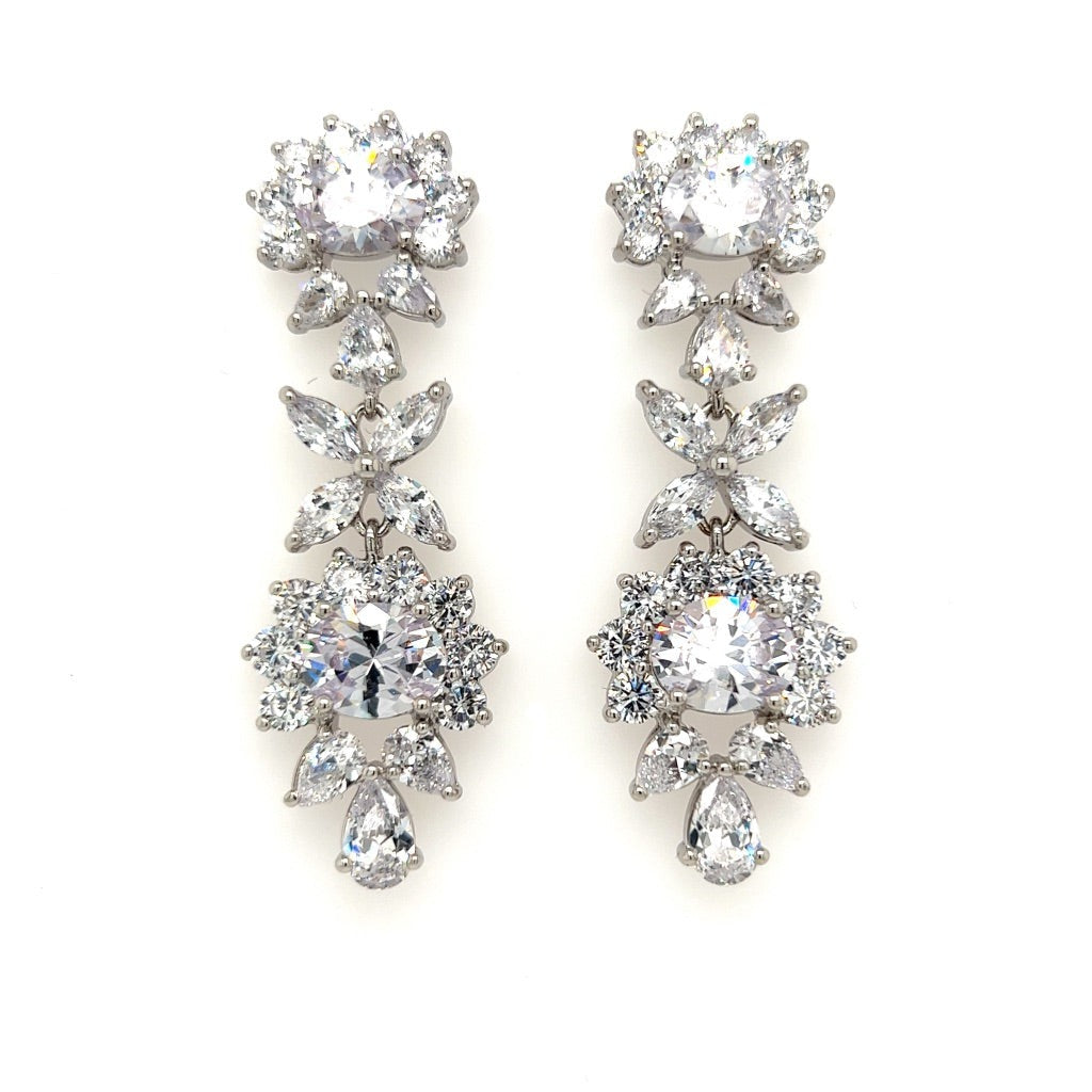 Vintage Style Dangle Earrings (style no. E202) feature round and marquise-cut clear gemstones in a floral design, set in silver metal and displayed on a white background.