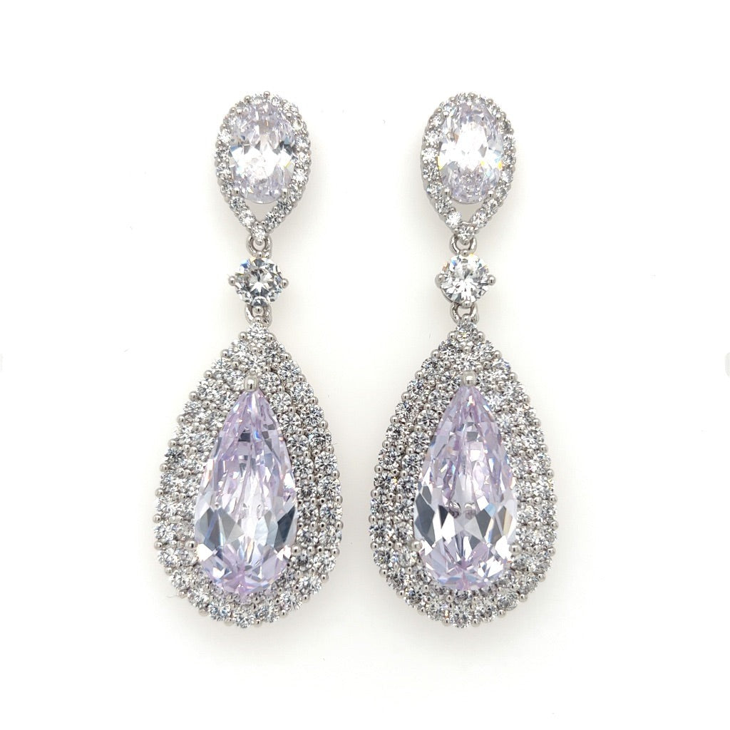 The Pear-shaped CZ Bridal Earrings (style no. E147) boast pear-shaped CZ gemstones with a halo of smaller stones. Above each teardrop is a smaller oval gem encircled by stones connected by a single round stone, perfect to pair with Swarovski crystal hair accessories.