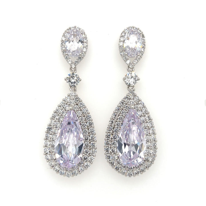 The Pear-shaped CZ Bridal Earrings (style no. E147) boast pear-shaped CZ gemstones with a halo of smaller stones. Above each teardrop is a smaller oval gem encircled by stones connected by a single round stone, perfect to pair with Swarovski crystal hair accessories.