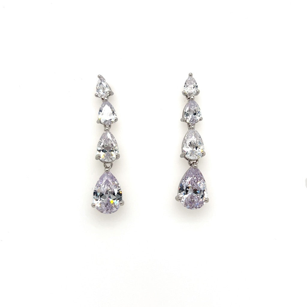 The Timeless CZ Drop Earrings (style no. E208) feature three vertically arranged, clear teardrop cubic zirconia stones—an elegant choice for classic bridal looks.