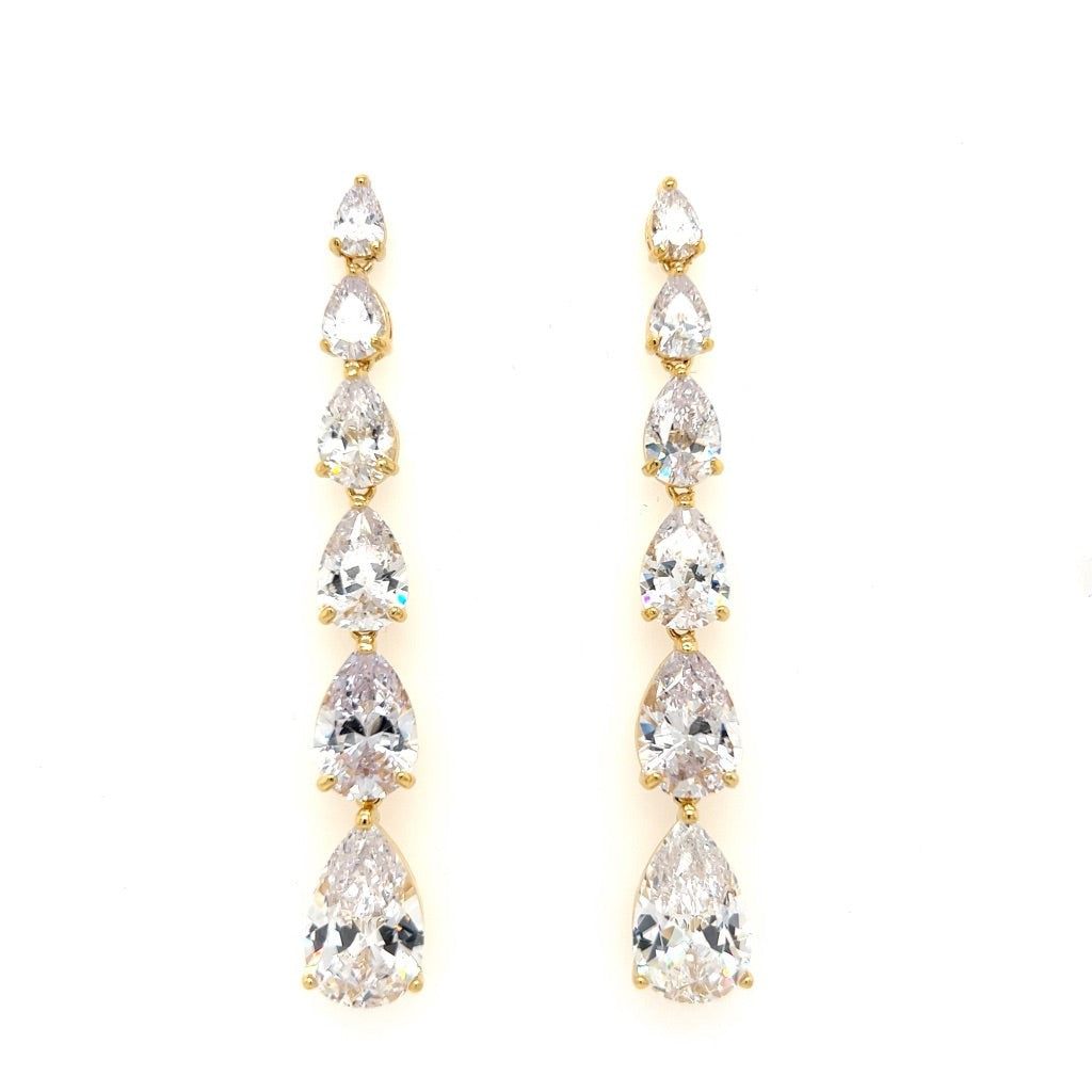 A pair of Timeless Gold Dangle Bridal Earrings (style no. E145), each with five graduated teardrop cubic zirconia stones set in gold, arranged from smallest to largest, shown against a white background.