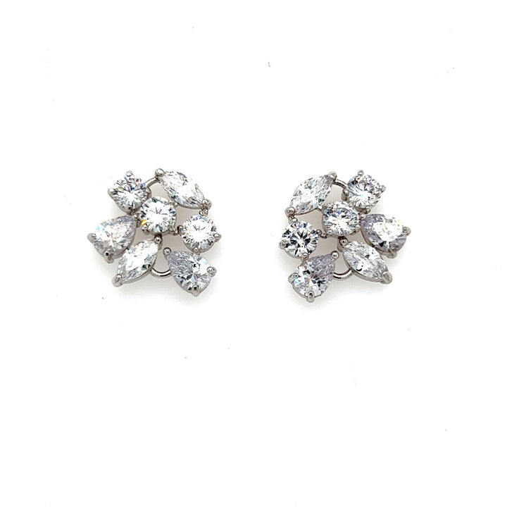 Close-up of the Bold Floral Bridal Stud Earrings (style no. E203) in silver, featuring multiple small clear gemstones arranged in a floral cluster. Displayed on a plain white background.
