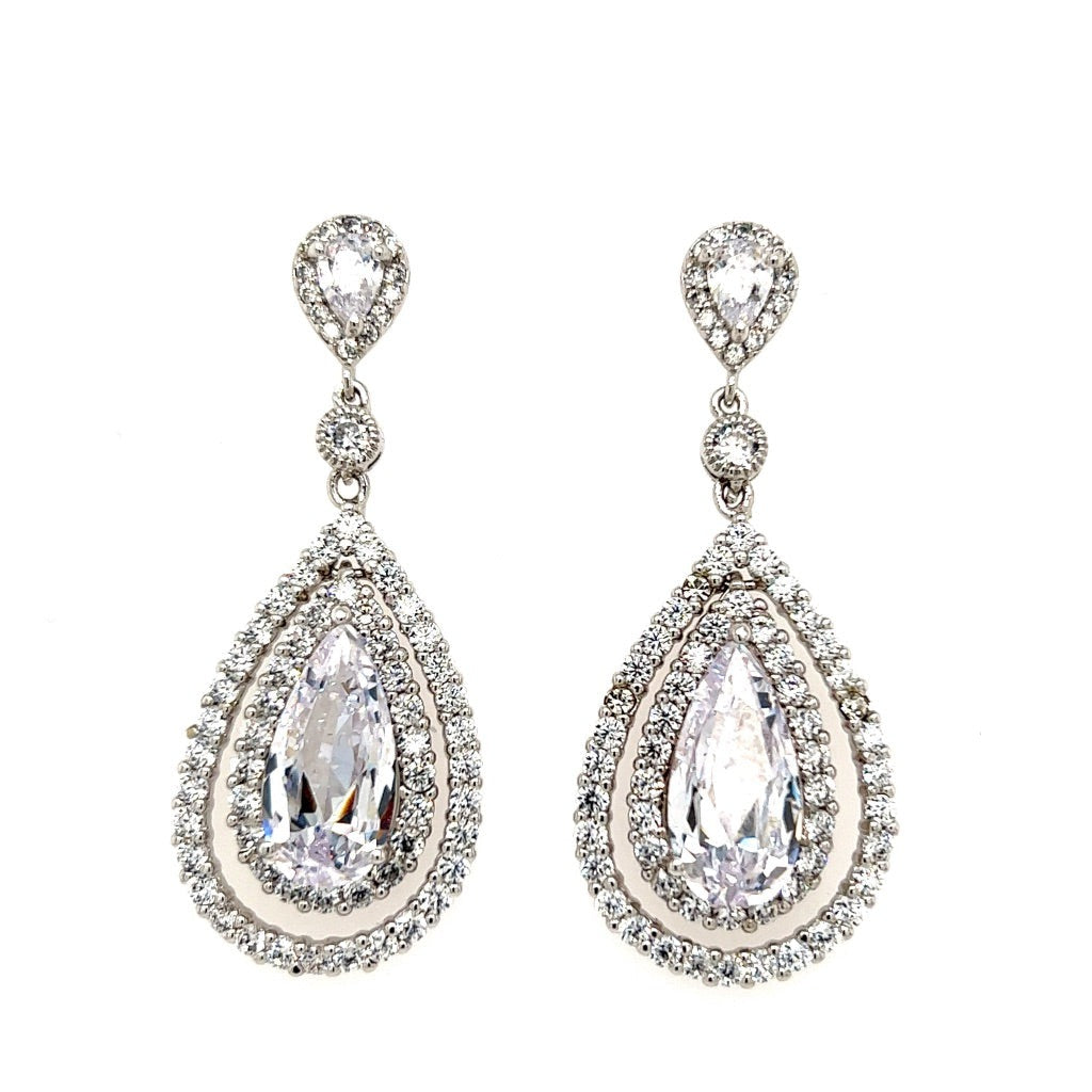 The Hollywood Glam Drop Earrings (style no. E205) feature large clear gemstones surrounded by sparkling stones and a smaller teardrop design—an elegant choice for wedding jewelry on your special day.