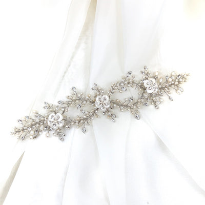 double looping pearl bridal hair vine with sprigs of crystal and white porcelain flowers