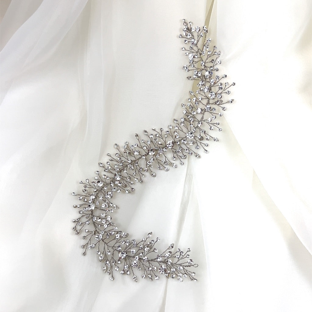 silver bridal hair vine with small branches of varying shaped crystals