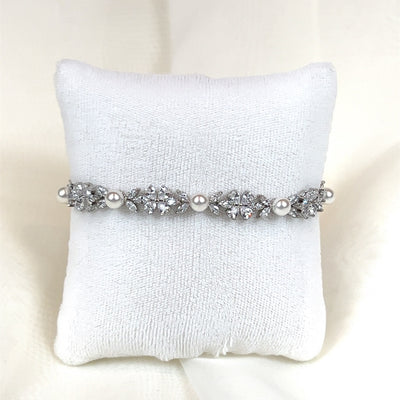 thin floral cubic zirconia bridal bracelet with peal detailing.