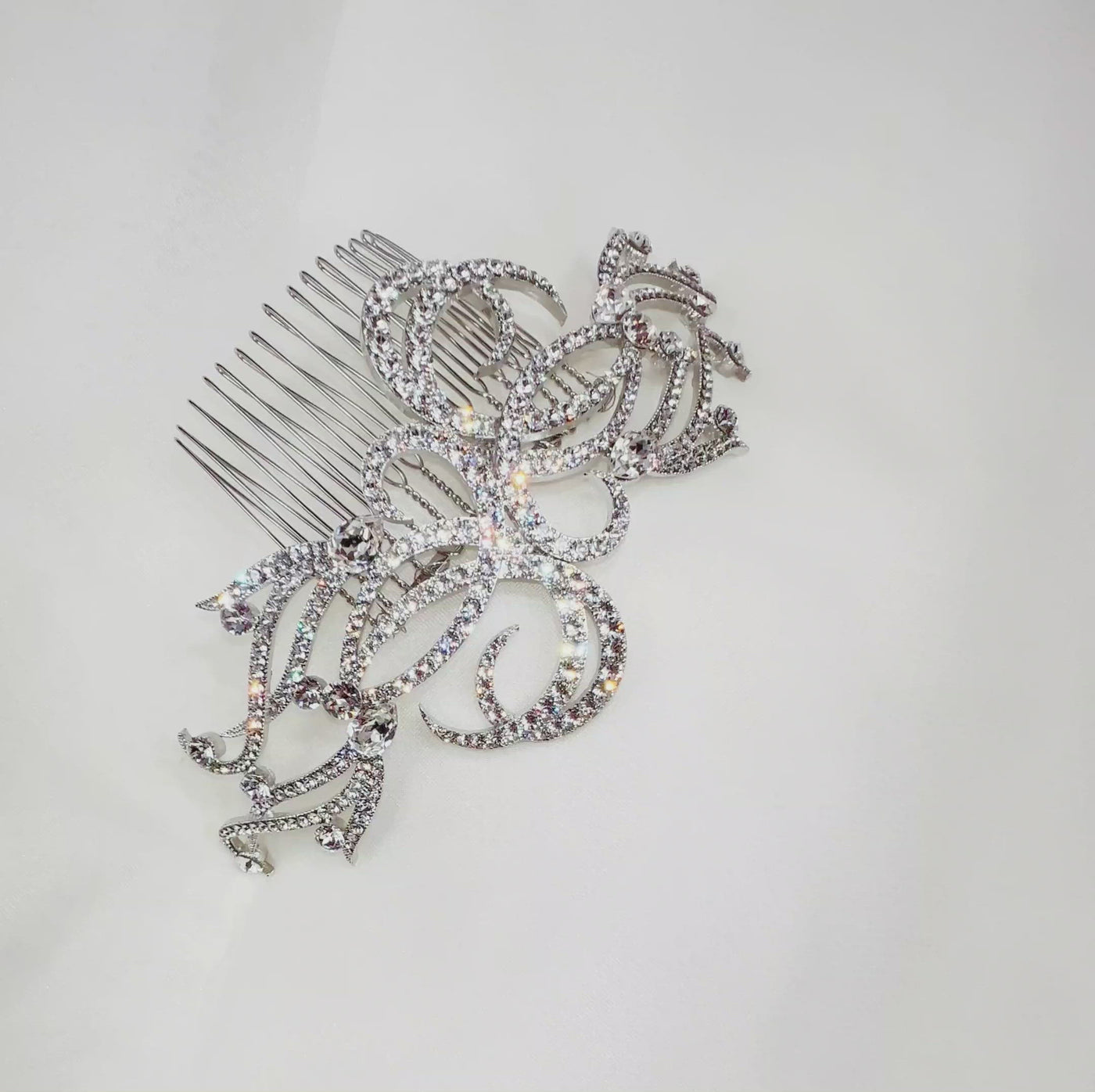 bridal hair comb with silver swirling branches and sparkling crystal details