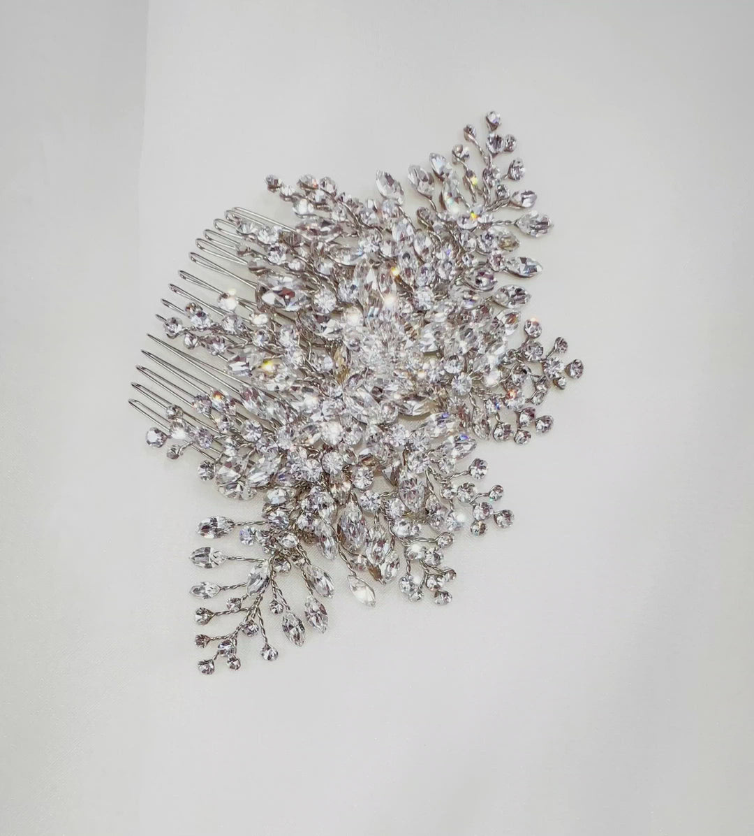 silver bridal hair comb with various sprigs of sparkling crystals