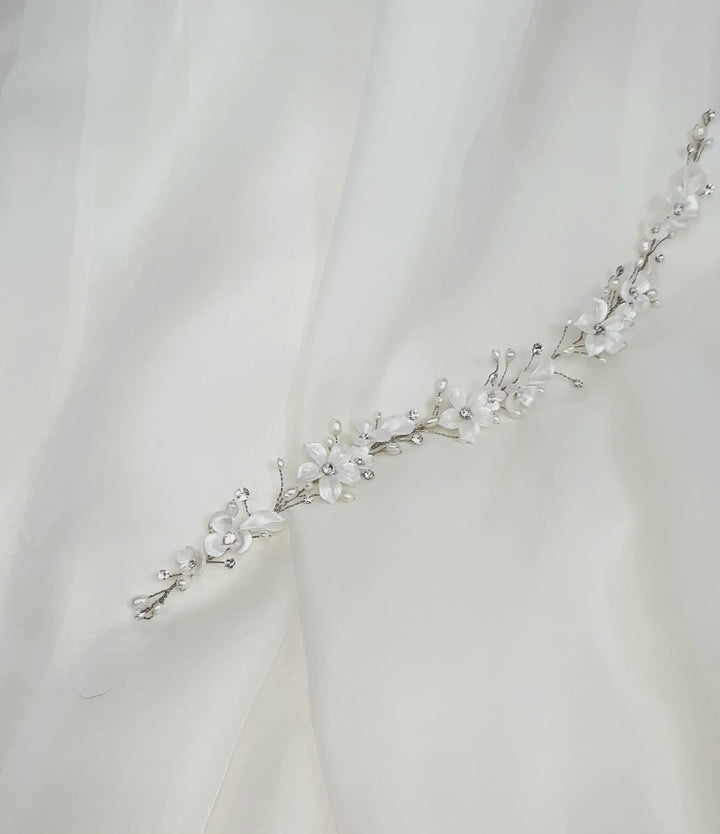 thin bridal hair vine with crystals, pearls, and porcelain flowers