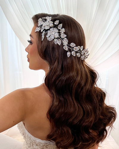 female model wearing crystalized flower hair vine, side view