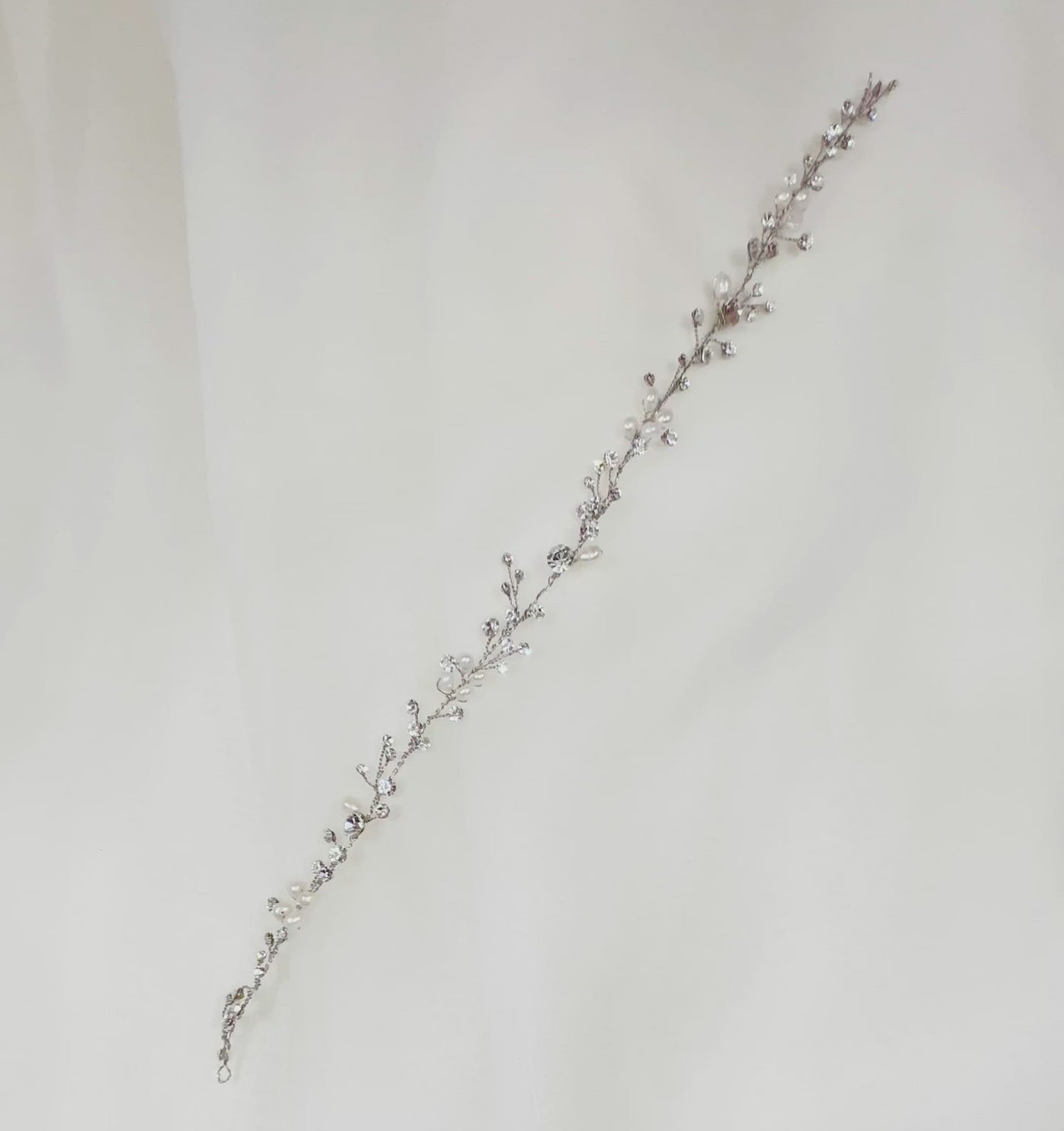 thin silver bridal hair vine with small crystals and glossy pearls