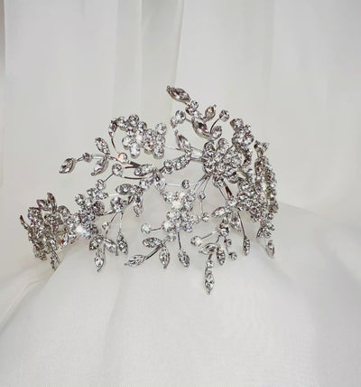 asymmetrical bridal headband with sparkling crystal clusters, leaves, and flowers