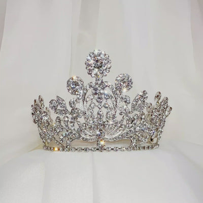 tall bridal crown with silver swirling details and sparkling round crystal peaks