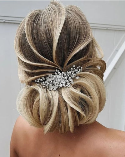 thin crystal hair comb with pearl detailing on bridal updo