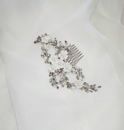 looping crystal bridal hair comb with porcelain flowers and pearl detailing