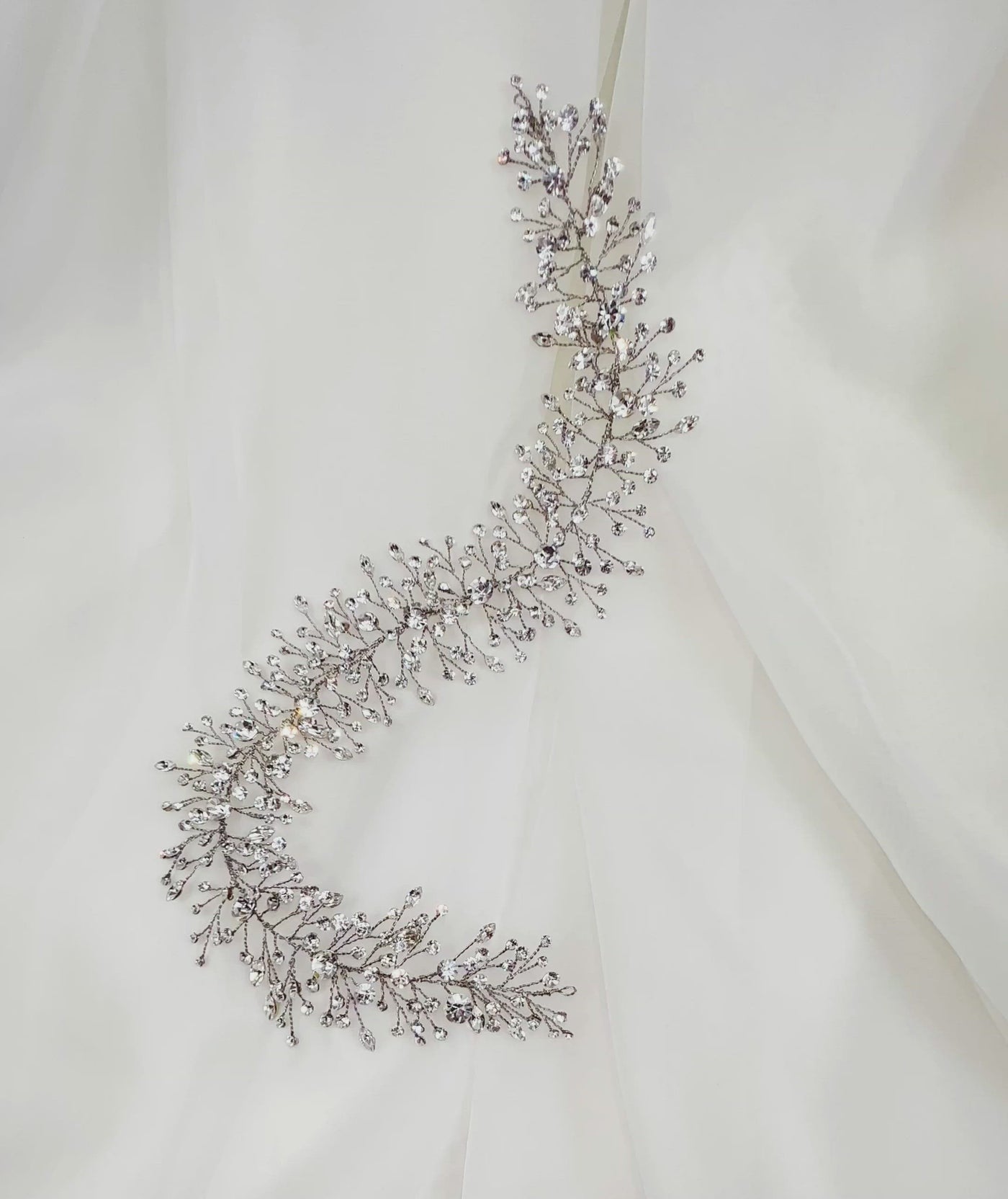 silver bridal hair vine with small branches of various sparkling crystals