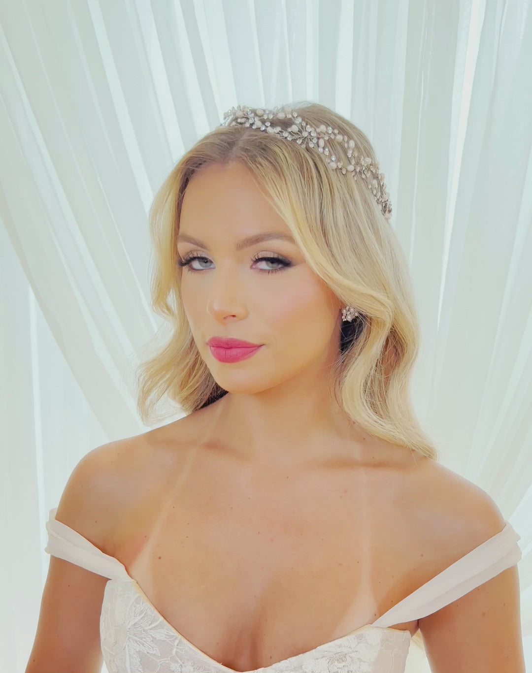 female model wearing asymmetrical crystal and pearl looping halo