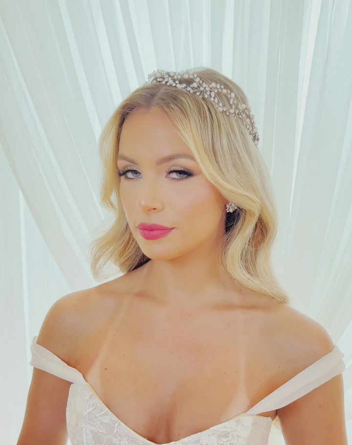 female model wearing asymmetrical crystal and pearl looping halo