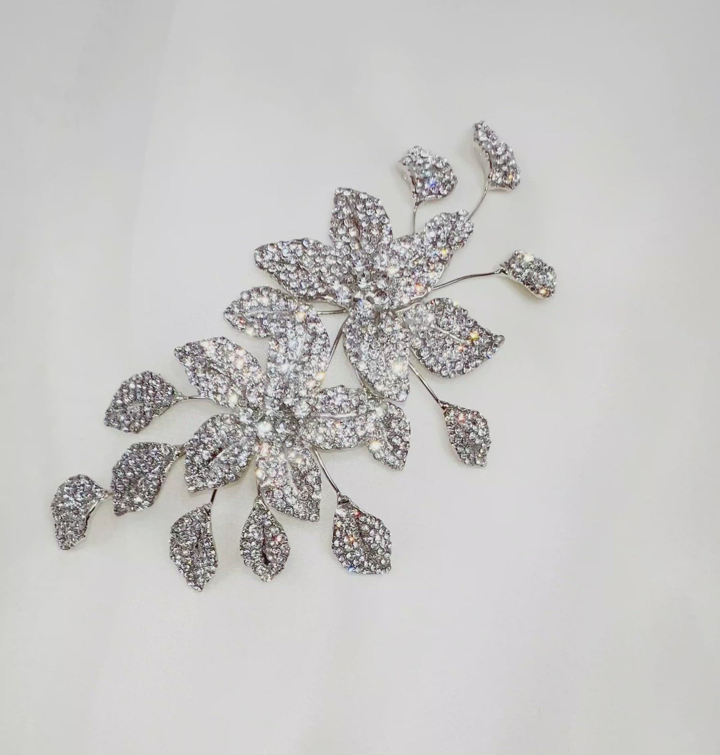 bridal hair comb with crystalized flowers and silver sprigs of leaves